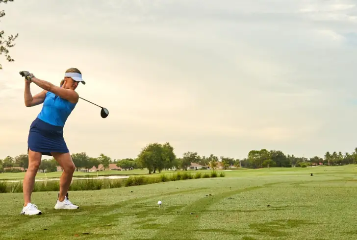 Woman playing golf